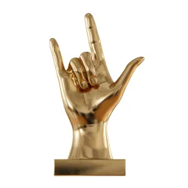 Figurine hand rock on table top